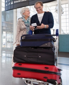 Couple with baggage at the airport. 